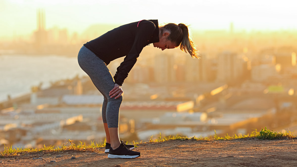 Exhausted Runner Resting After Running In City Outskirts Exhausted Runner Resting After Running In City Outskirts