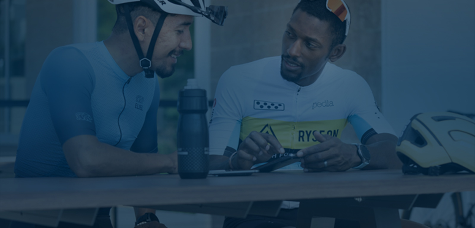 The Best In The Game For Coaches. Coach Showing Male Cyclist How To Train With Trainingpeaks.