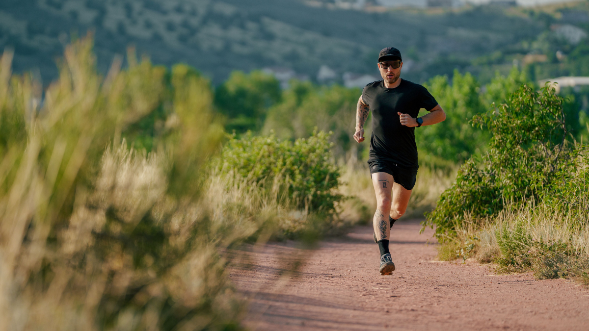 Male Trail Runner Athlete Doing Micro Burst Training Outside On Dirt Running Trail To Improve Vo2 Max